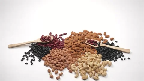 Assorted Mixed Nuts and Beans Stop Motion on White Background Stock Footage 336706944
