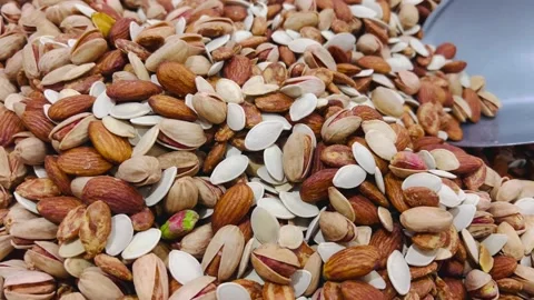 Assorted mixed nuts and seeds in a large pile, horizontal view Stock Footage 345156120