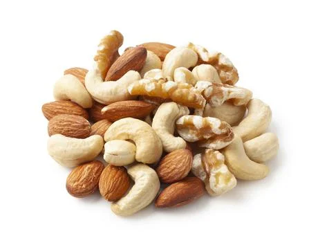 Assorted mixed nuts on white background Foto stock
