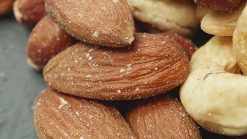 Assorted mixed shelled nuts macro close up presentation slowly rotating sto.. 库存影片 344797057