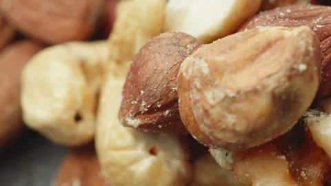 Assorted mixed shelled nuts macro close up presentation slowly rotating sto.. 库存影片 344797321