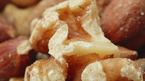 Assorted mixed shelled nuts macro close up presentation slowly rotating sto.. Stock Footage 344797468