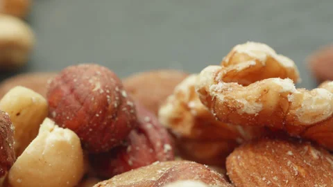 Assorted mixed shelled nuts macro close up presentation slowly rotating sto.. Stock Footage 344797585
