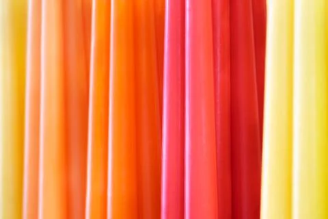 Assorted multicolour wax candles Stock Photos