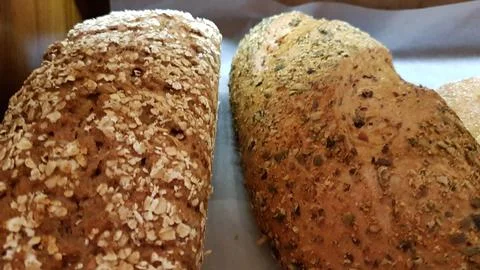Assorted Multigrain Bread Rolls with Oats and Seeds on a Bakery Display Stock Photos