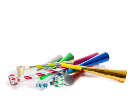 Assorted noise makers on white with copy space Stock Photos