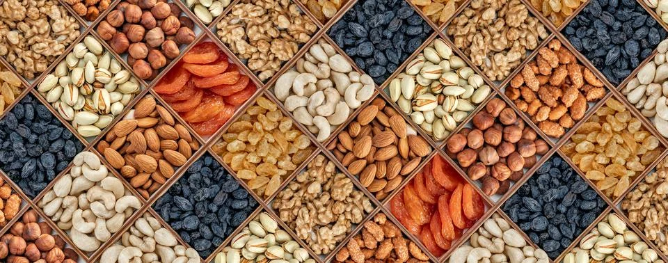 Assorted nuts and dried fruit collection. Assorted nuts almonds, pistachio, c Stock Photos
