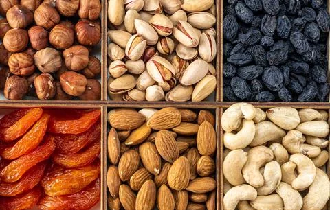 Assorted nuts and dried fruit collection. Assorted nuts almonds, pistachio, c Stock Photos