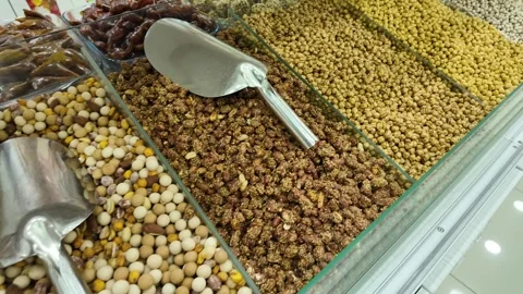 Assorted Nuts and Dried Fruits Displayed in a Market Stock Footage 344889413