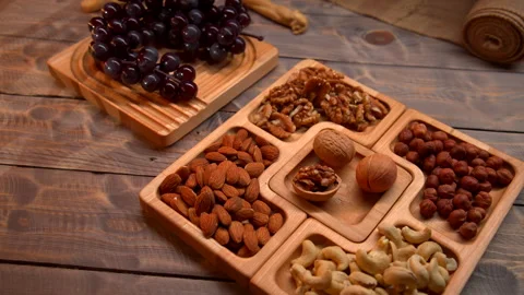 Assorted Nuts and Raisins on Trays Stock Footage 273710180