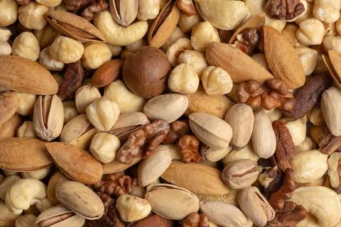 Assorted nuts and seeds: walnuts, almonds, hazelnuts, cashews, pistachios Stock Photos