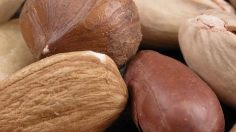 Assorted nuts close-up. Extreme macro. Видео 141338266