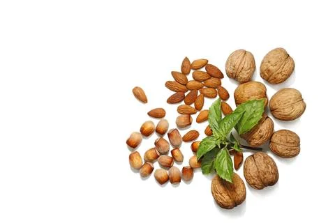 Assorted Nuts with Fresh Basil Garnish Stock Photos
