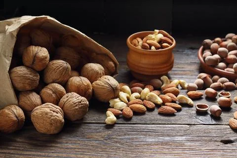 Assorted nuts mix with walnuts in shell almonds hazelnuts and cashews on ru.. 写真素材