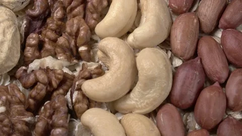 Assorted nuts on oatmeal close-up. Natural healthy eating. Stock Footage 141794274