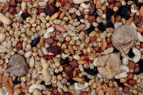 Assorted nuts scattered as a colorful background Stock Photos