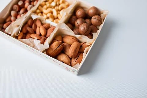 Assorted nuts in a wooden box nuts: pecan, almond, macadamia, brazil, cashew, Stock Photos