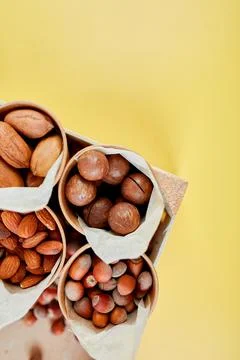 Assorted nuts in a wooden box nuts: pecan, almond, macadamia, brazil, cashew, Stock Photos