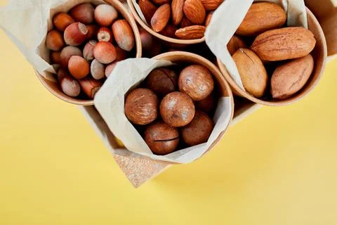 Assorted nuts in a wooden box nuts: pecan, almond, macadamia, brazil, cashew, Stock Photos