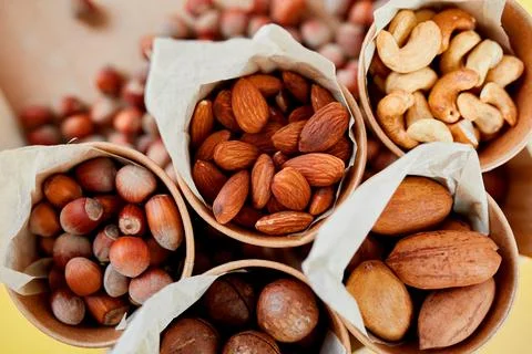 Assorted nuts in a wooden box nuts: pecan, almond, macadamia, brazil, cashew, Stock Photos