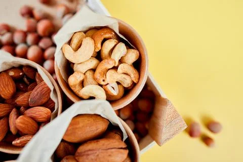 Assorted nuts in a wooden box nuts: pecan, almond, macadamia, brazil, cashew, Stock Photos
