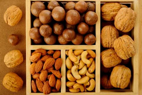 Assorted nuts in wooden box Stock Photos