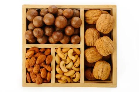 Assorted nuts in wooden box Stock Photos