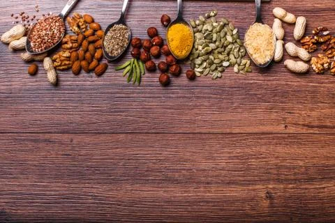 Assorted nuts on wooden surface Stock Photos