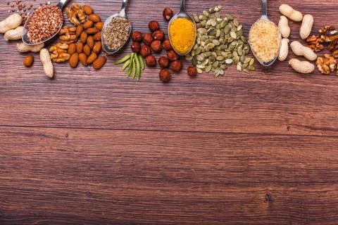 Assorted nuts on wooden surface Stock Photos