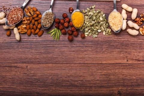 Assorted nuts on wooden surface Stock Photos