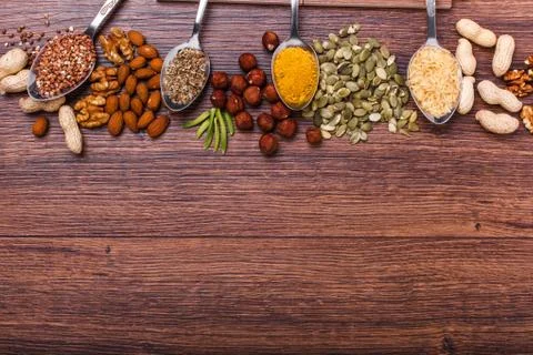 Assorted nuts on wooden surface Stock Photos