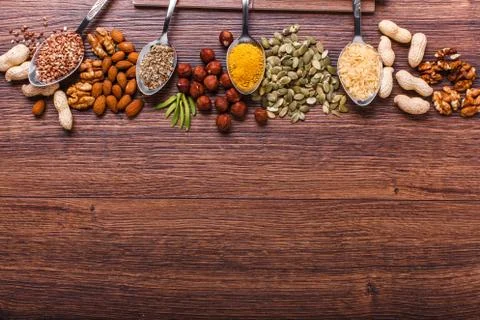 Assorted nuts on wooden surface Stock Photos