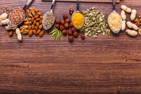 Assorted nuts on wooden surface Stock Photos
