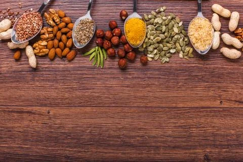 Assorted nuts on wooden surface Stock Photos