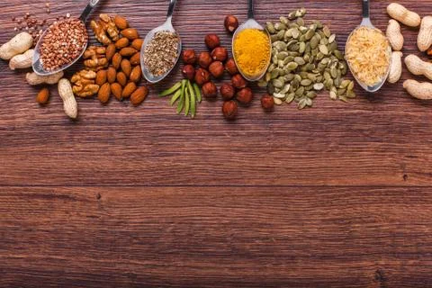 Assorted nuts on wooden surface Stock Photos