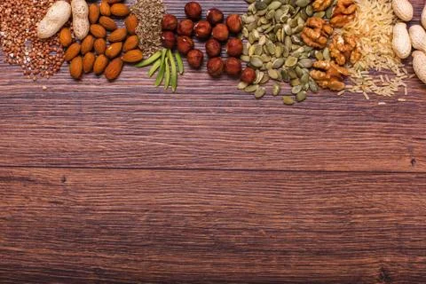 Assorted nuts on wooden surface Stock Photos