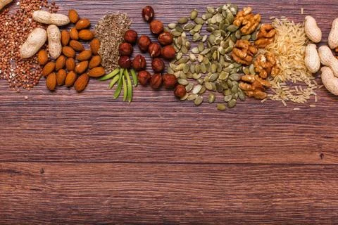 Assorted nuts on wooden surface Stock Photos