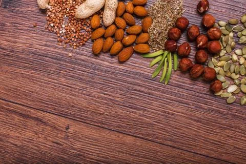 Assorted nuts on wooden surface Stock Photos