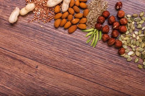 Assorted nuts on wooden surface Stock Photos
