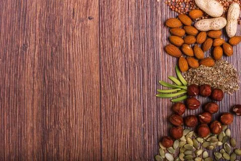 Assorted nuts on wooden surface Stock-Fotos