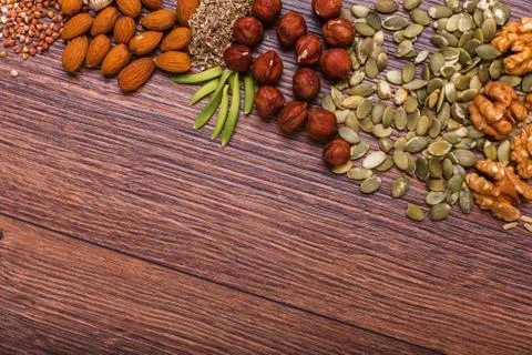 Assorted nuts on wooden surface Stock Photos