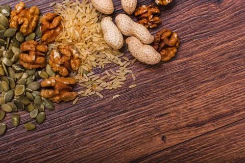 Assorted nuts on wooden surface Stock Photos
