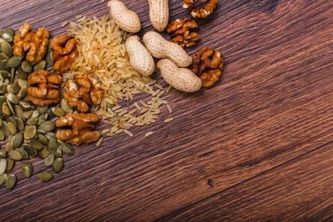 Assorted nuts on wooden surface Stock Photos