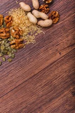 Assorted nuts on wooden surface Stock Photos