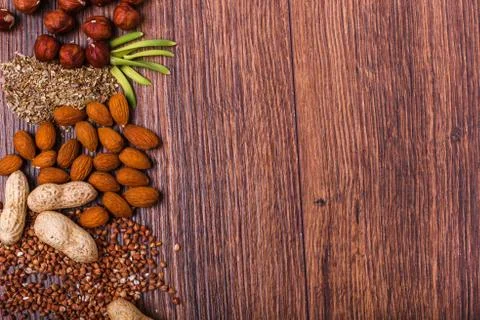 Assorted nuts on wooden surface Stock Photos