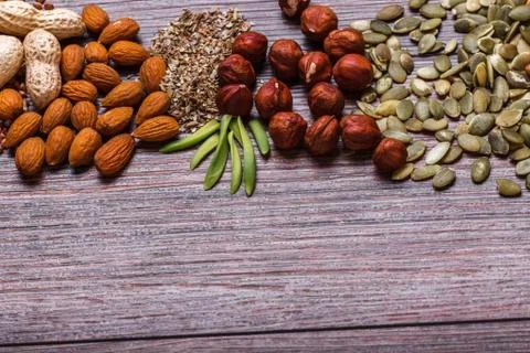 Assorted nuts on wooden surface Stock Photos