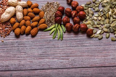 Assorted nuts on wooden surface Stock Photos
