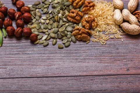 Assorted nuts on wooden surface Stock Photos