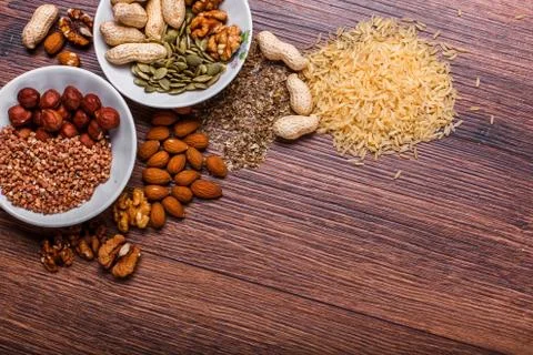 Assorted nuts on wooden surface Stock Photos