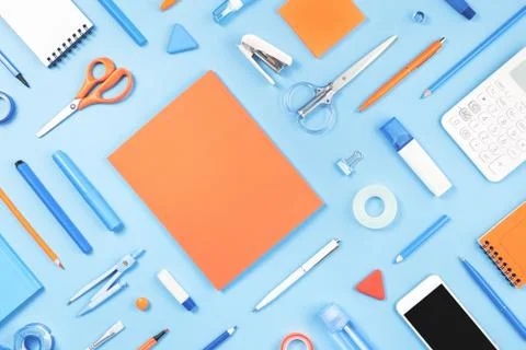 Assorted office and school white blue and orange stationery Stock Photos